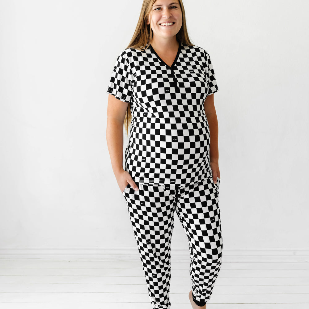 woman wearing Cool Checks printed pajama pants paired with a matching Cool checks printed women's pajama shirt