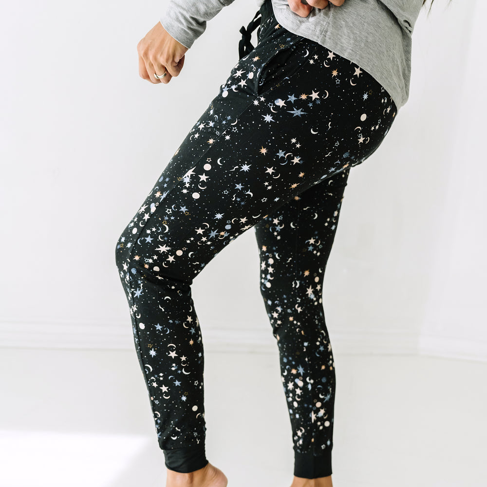 Close up side view image of a woman wearing Counting Stars women's pajama pants
