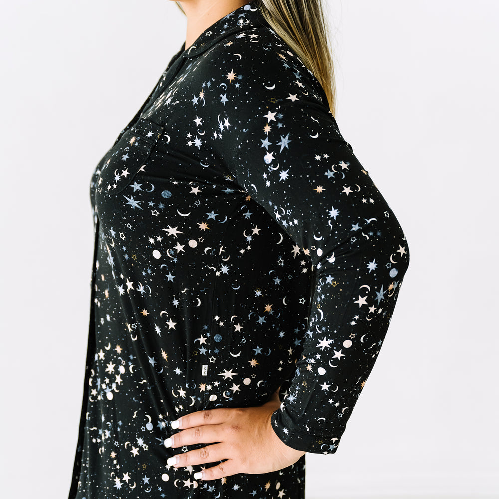 Close up side view image of a woman wearing a Counting Stars printed women's sleep shirt