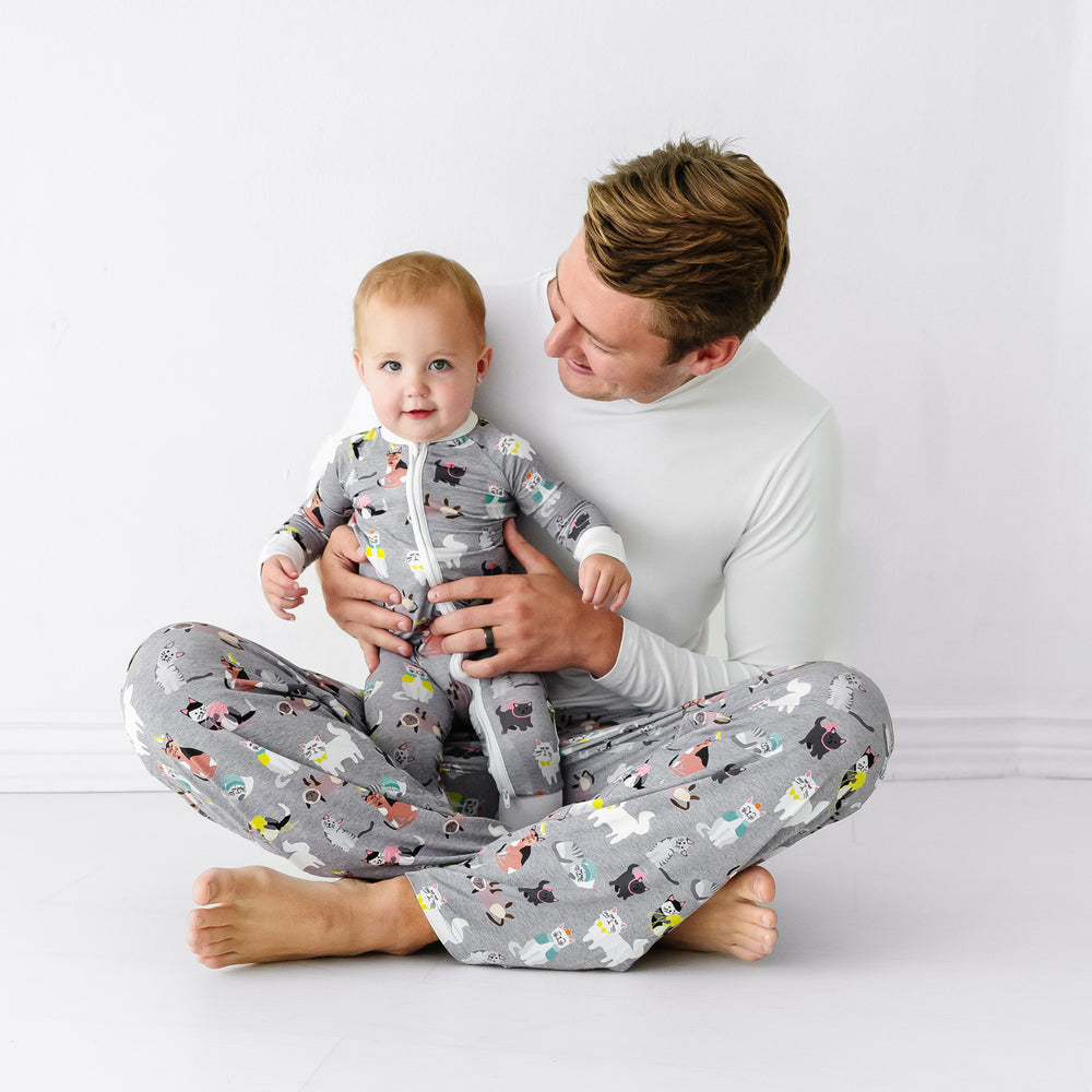 Father and child wearing matching Cozy Cats pajamas