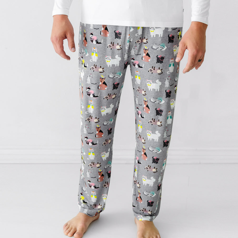 Close up image of a man wearing Cozy Cats men's pajama pants