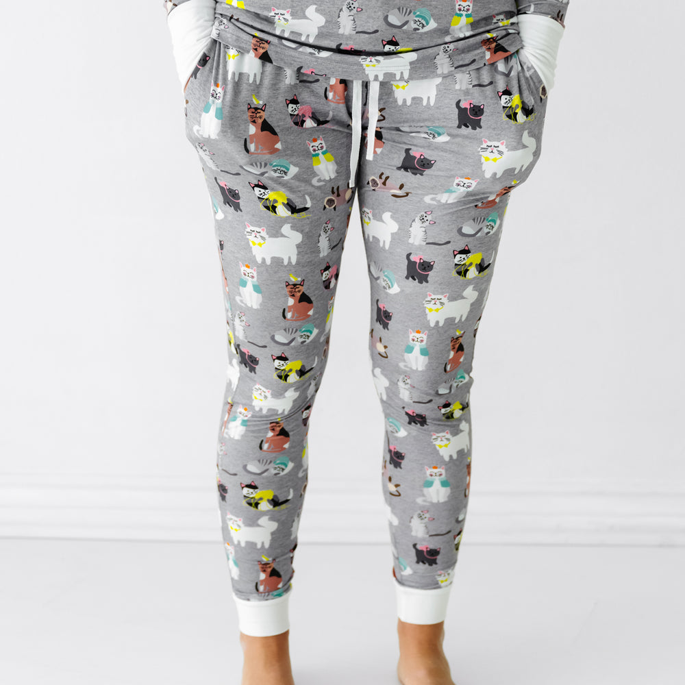 Close up image of a woman wearing Cozy Cats women's pajama pants