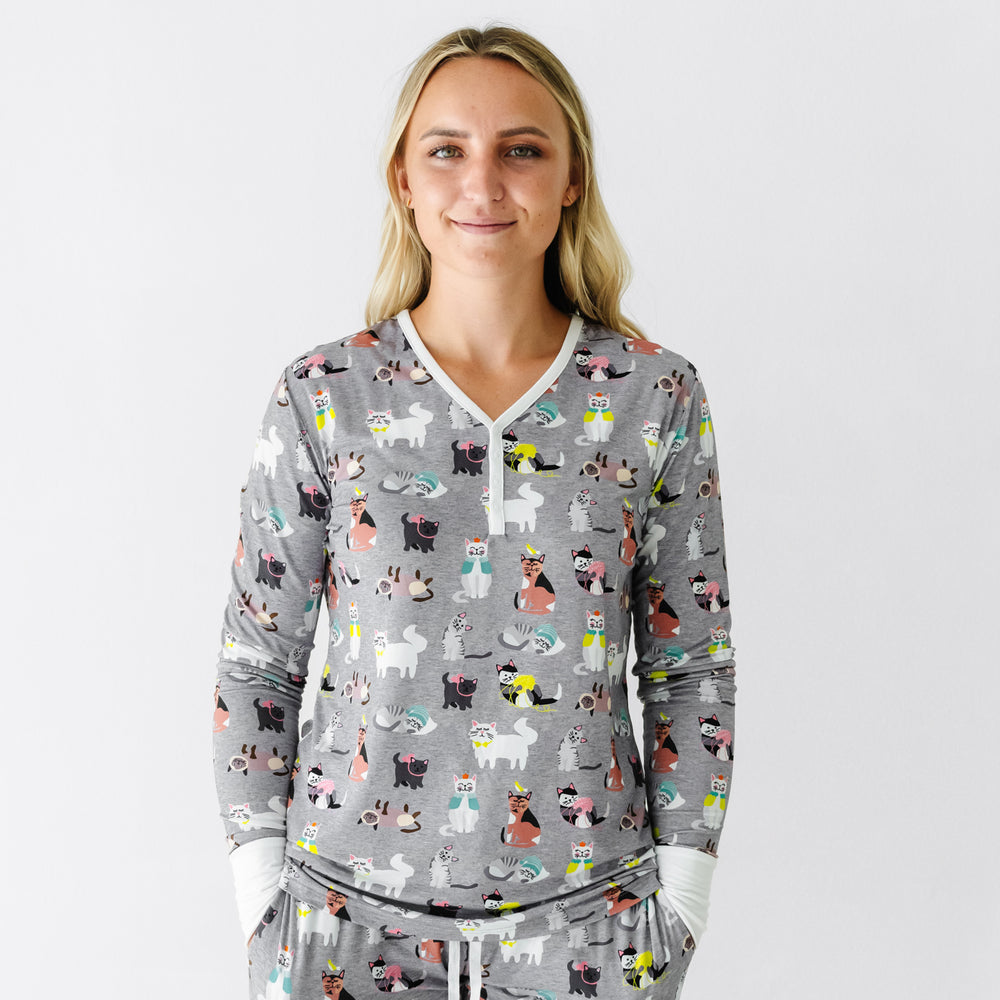 Close up image of a woman wearing a Cozy Cats women's pajama top