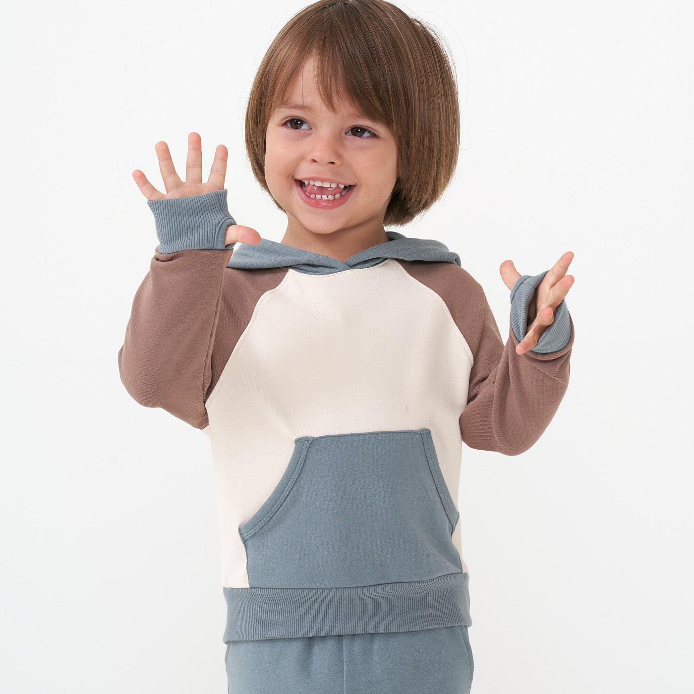 Close up image of a child wearing a Colorblock pullover hoodie