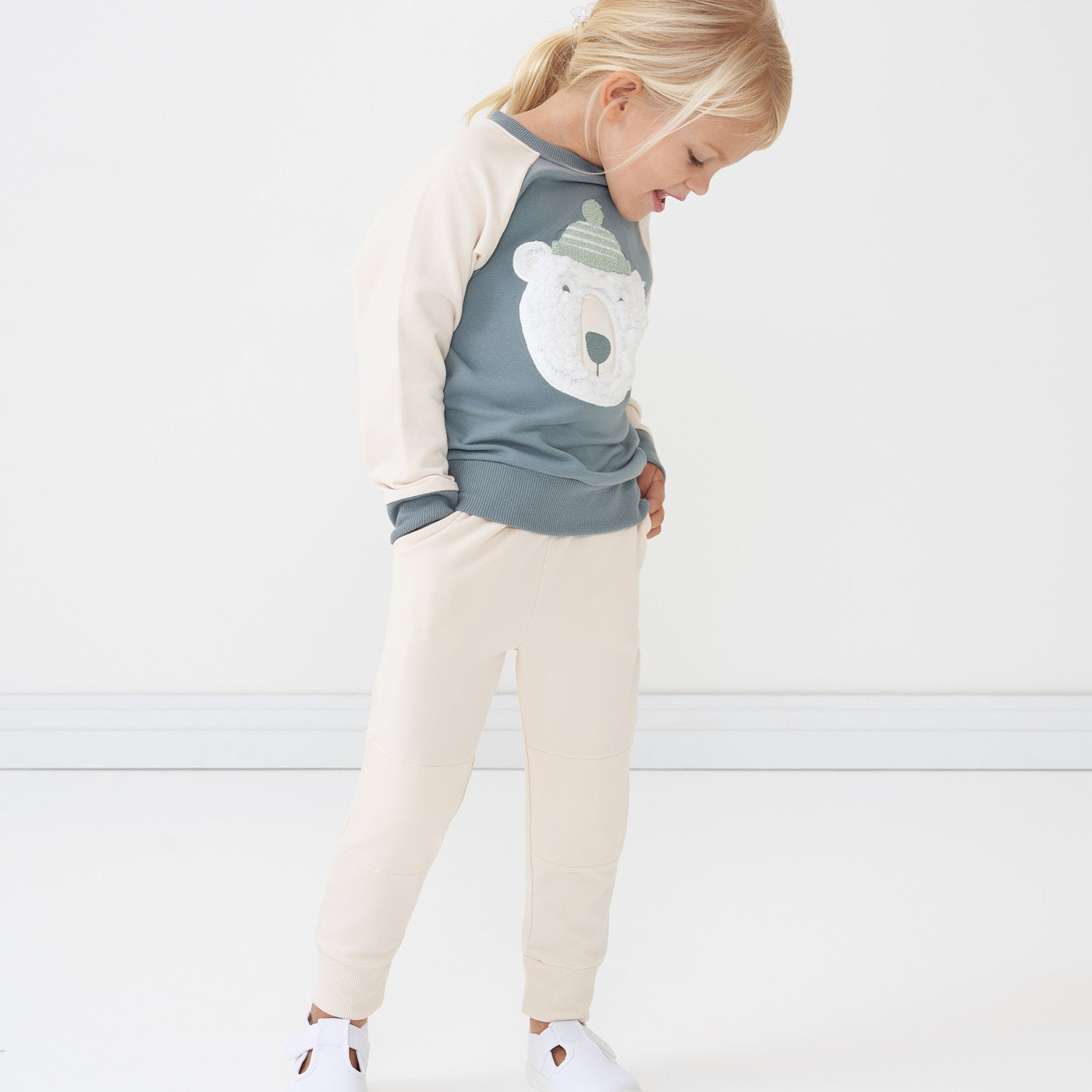 Child wearing Cream joggers and coordinating Polar Bear crewneck sweatshirt