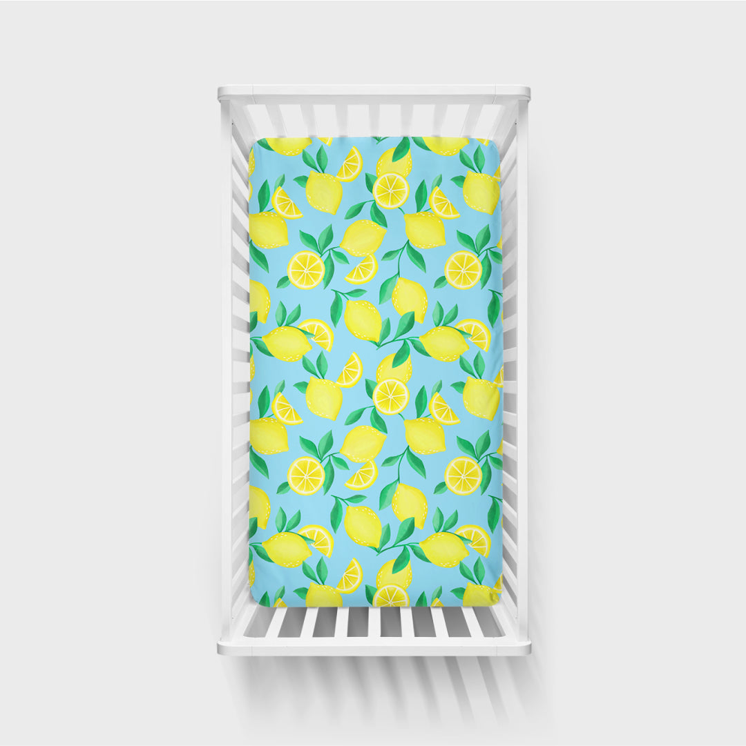 Aerial view of the Blue Sunny Citrus Fitted Crib Sheet