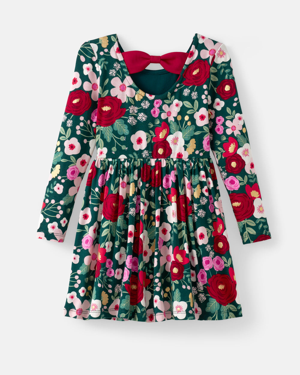 A long-sleeve floral dress with a dark green base, featuring red, pink, and white flowers, a smocked waist, and a contrasting dark red bow at the neckline, shown on a light gray background.