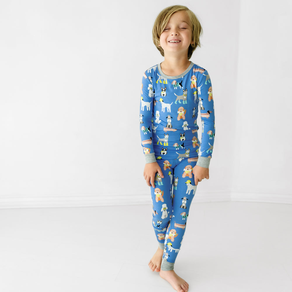 Child wearing a Dapper Dogs two-piece pajama set