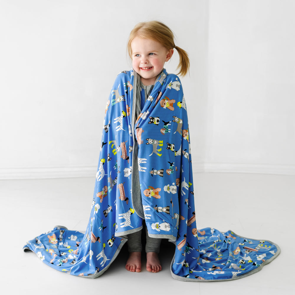 Child wrapped up in a Dapper Dogs large cloud blanket
