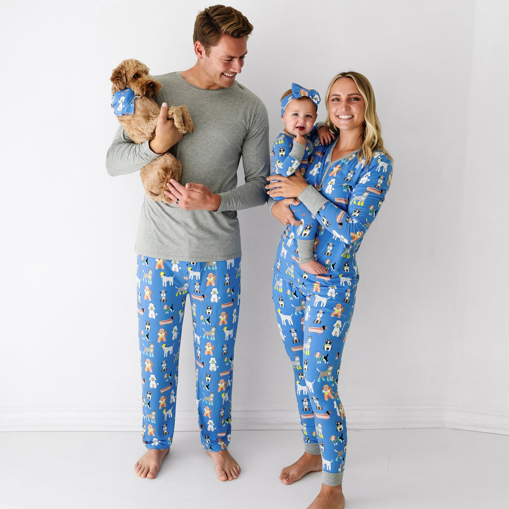 Family of three and dog wearing matching Dapper Dogs pajamas and pet bandana