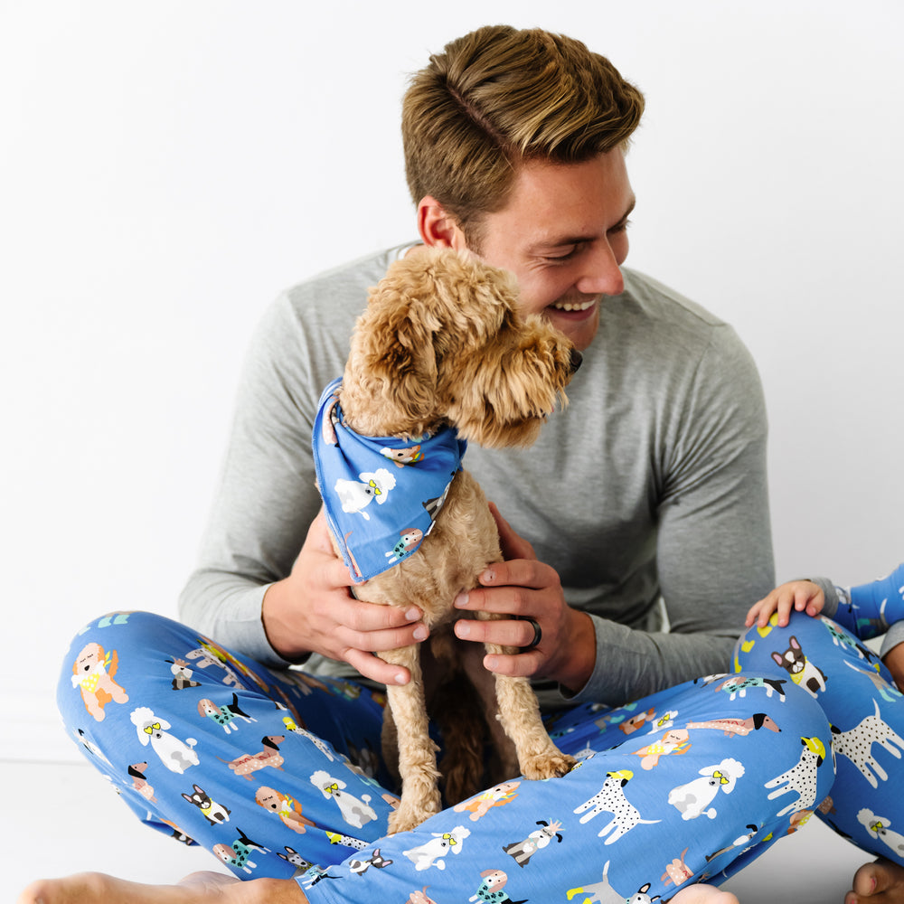 Man and dog wearing matching Dapper Dogs pajamas and pet bandana