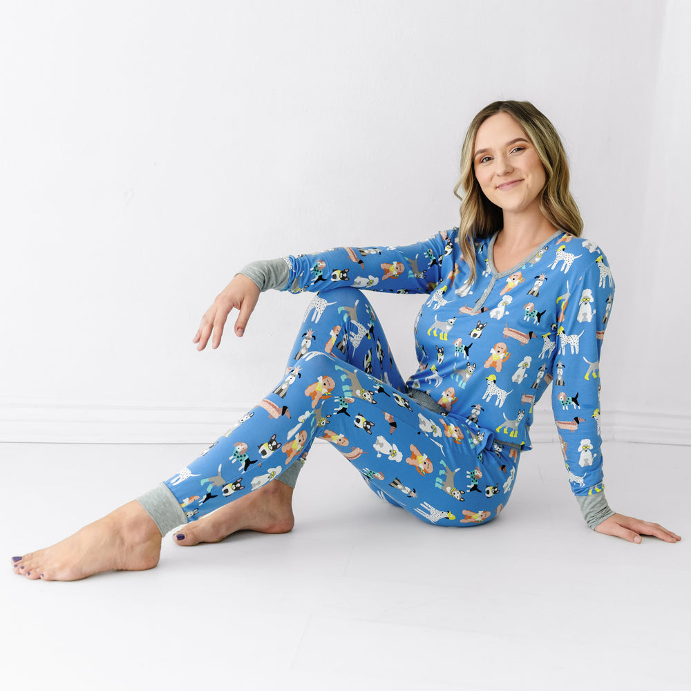 Alternate image of a woman sitting on the ground wearing a Dapper Dogs women's pajama top and matching pajama pants