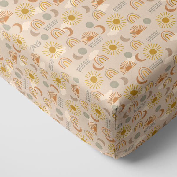 Corner view of a Desert Sunrise fitted crib sheet