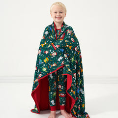 Child wrapped up in a Disney Christmas Party Large Cloud Blanket