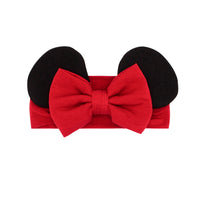 Flat lay image of a Minnie Mouse Red luxe bow headband