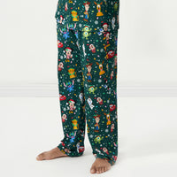 Close up image of a man wearing Disney Christmas Party Men's Pajama Pants
