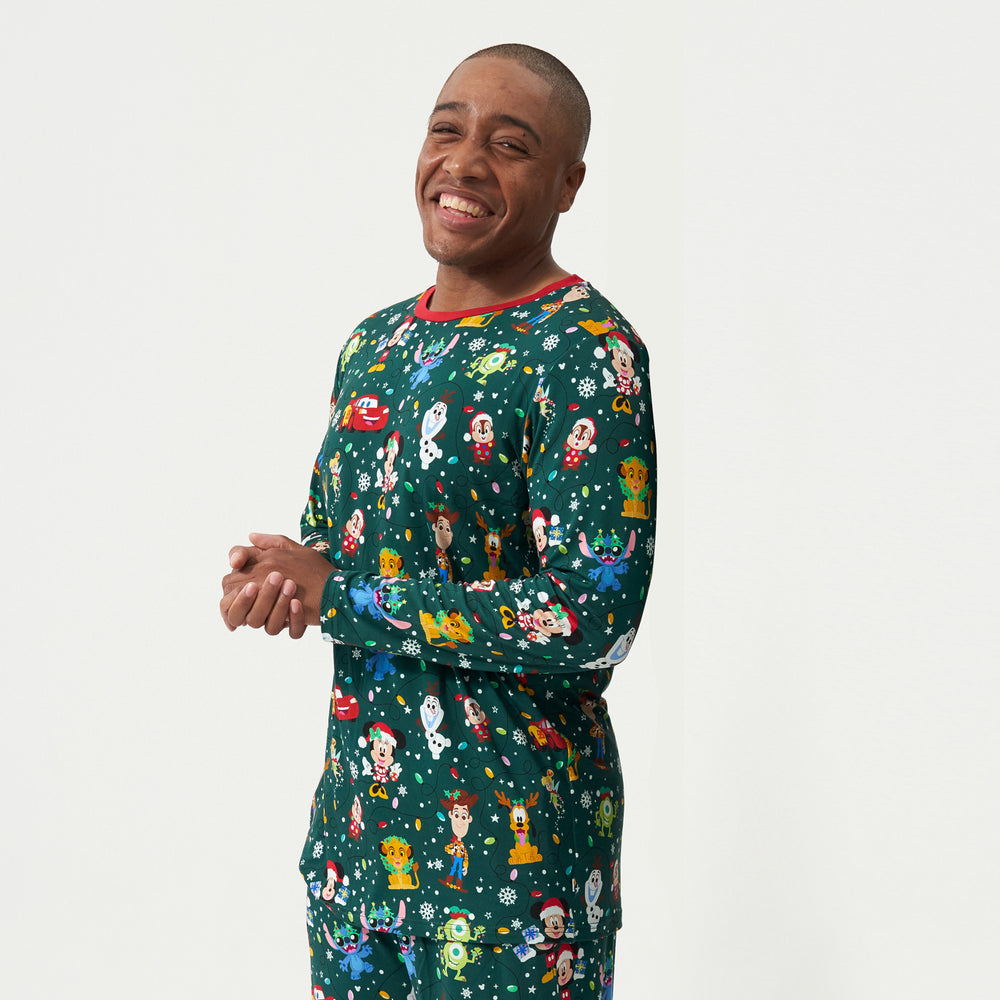 Close up image of a man wearing a Disney Christmas Party men's pajama top