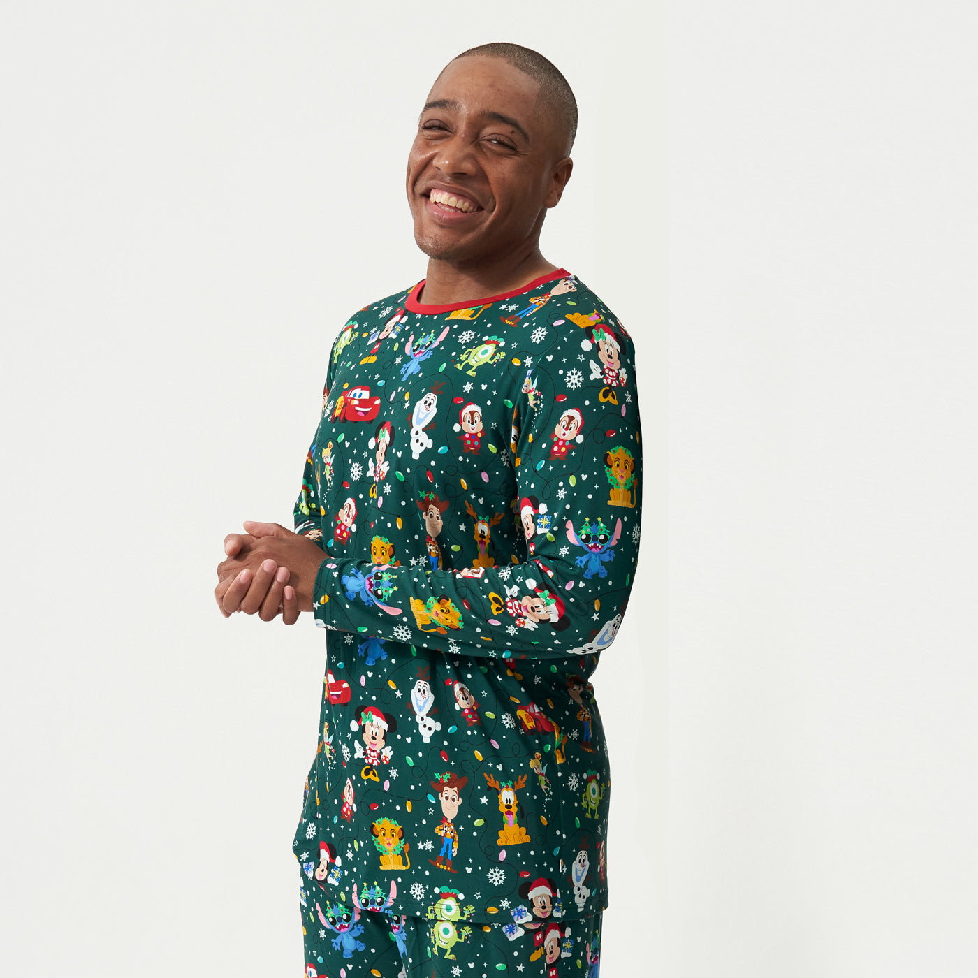Close up image of a man wearing a Disney Christmas Party men's pajama top