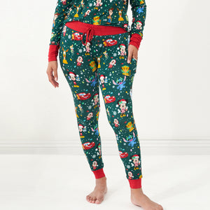 Close up image of a woman wearing Disney Christmas Party Women's Pajama Pants