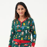 Close up image of a woman wearing a Disney Christmas Party women's pajama top
