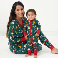 Mother and child wearing matching Disney Christmas Party pajamas