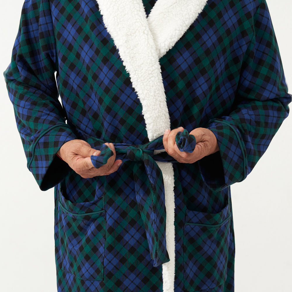 Close up image of a man wearing an Emerald Plaid cozy robe detailing the waistband tie