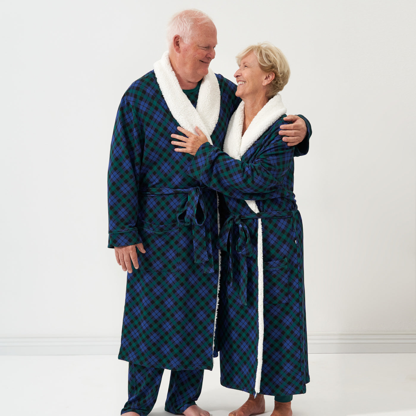 Alternate image of a man and woman wearing Emerald Plaid cozy robes