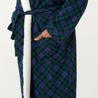 Alternate close up image of a man wearing an Emerald Plaid cozy robe detailing the pocket