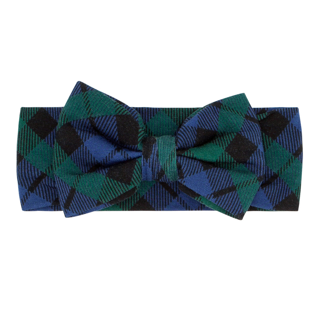 Flat lay image of an Emerald Plaid luxe bow headband