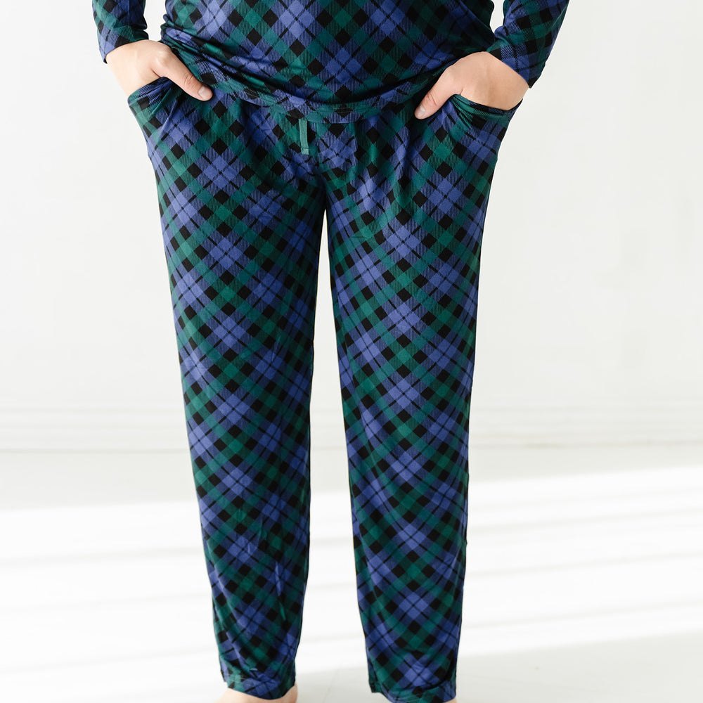 Close up image of a man wearing Emerald Plaid men's pajama pants