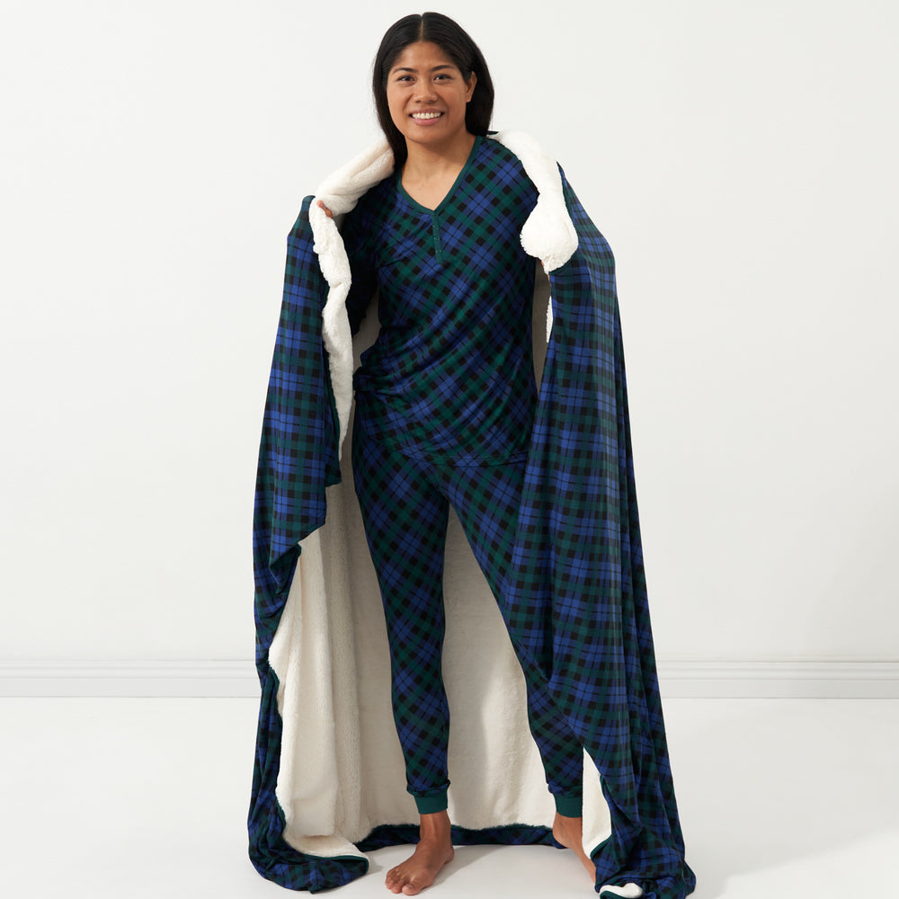 Woman with an Emerald Plaid plush oversized cloud blanket wrapped around her