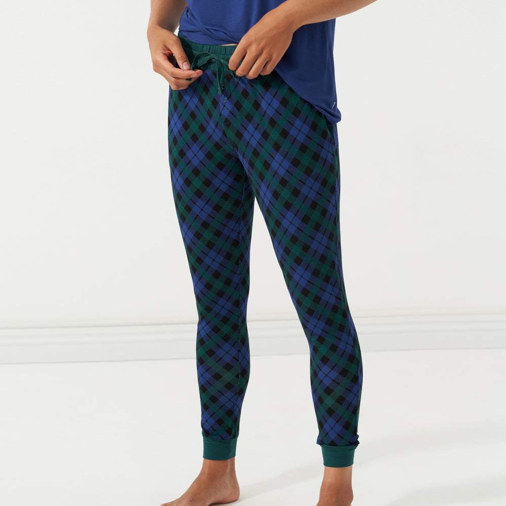 Close up image of a woman wearing Emerald Plaid women's pajama pants