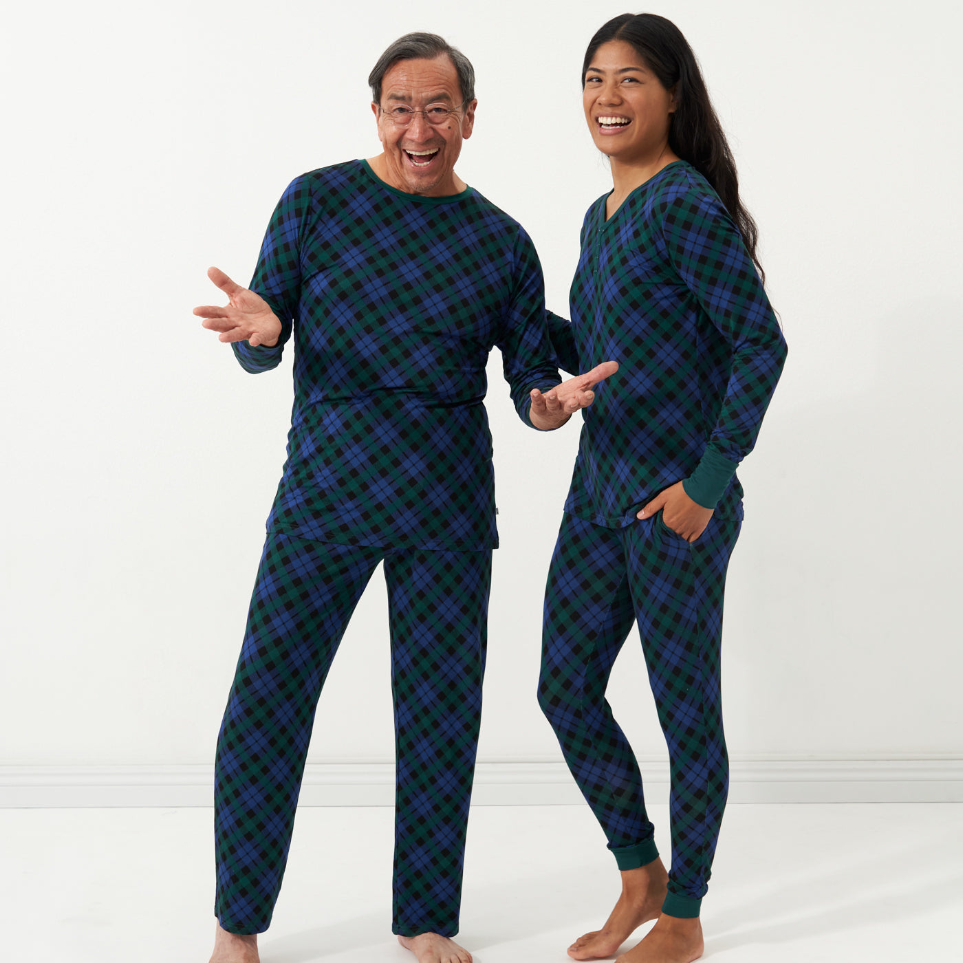 Alternate image of a man and woman wearing matching Emerald Plaid pajamas