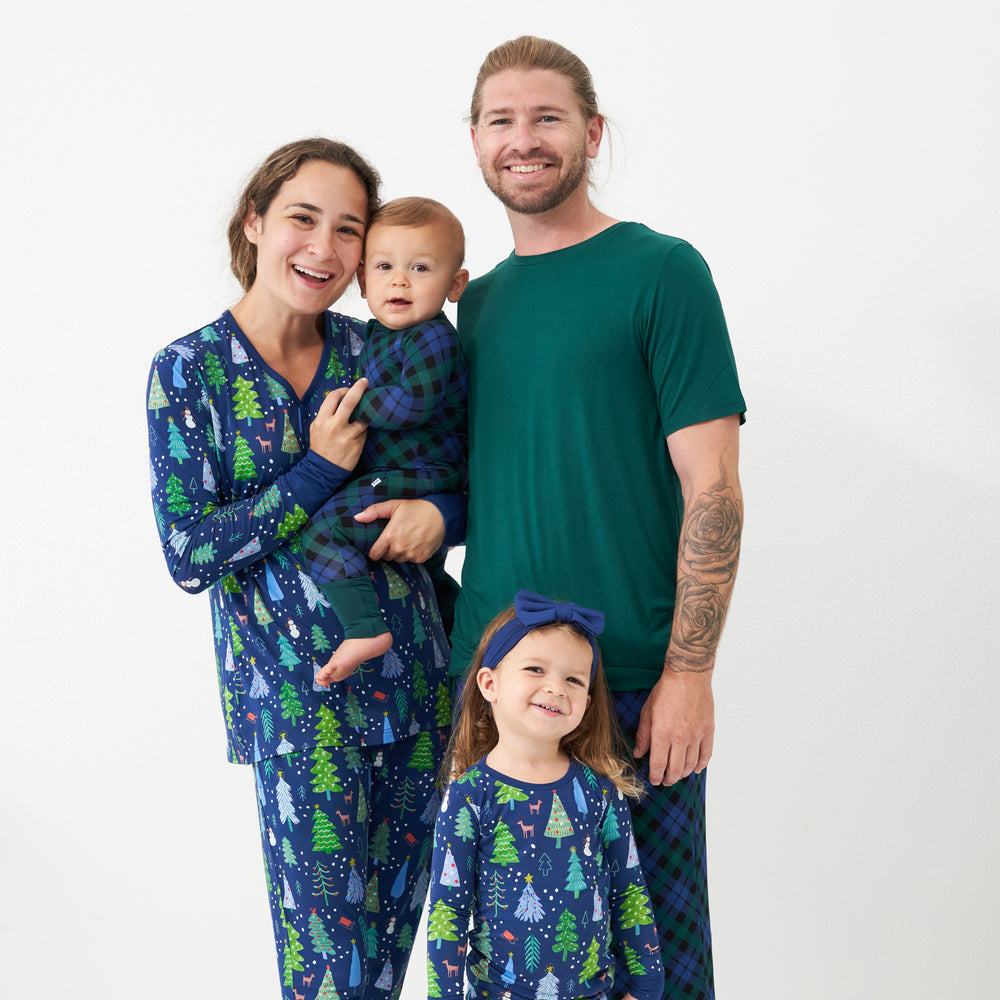 Family wearing coordinating holiday pajamas by Little Sleepies
