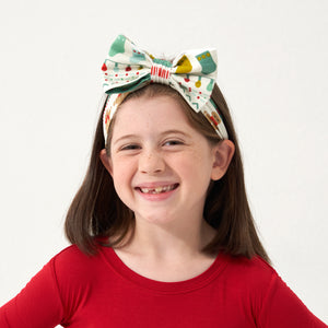 Child wearing a Fair Isle Luxe Bow Headband