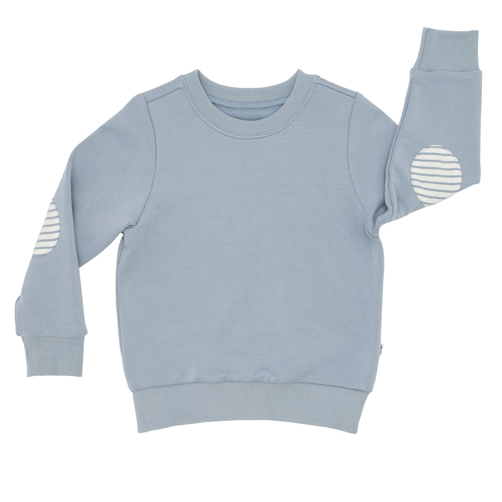 Click to see full screen - Flat lay image of a Fog elbow patch crewneck