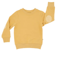 Flat lay image of a Honey elbow patch crewneck