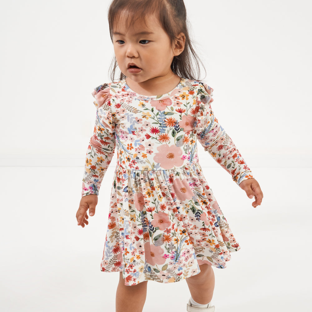 Click to see full screen - Child wearing a Mauve Meadow twirl dress with bodysuit