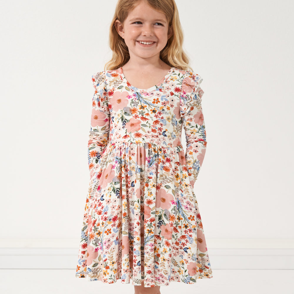 Child wearing a Mauve Meadow printed twirl dress