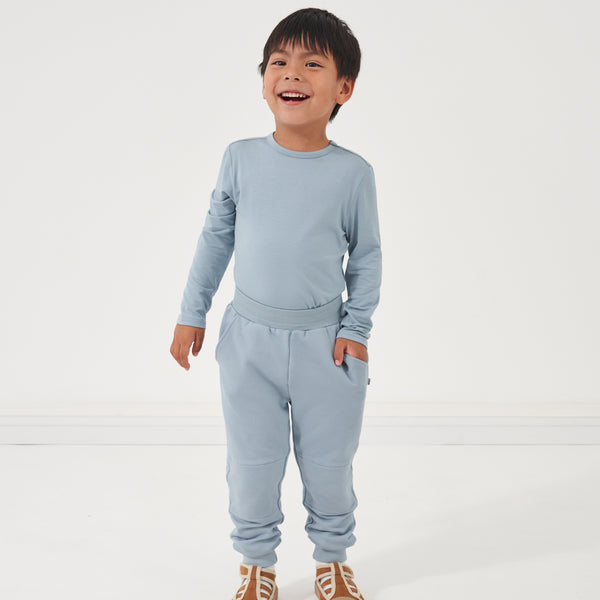 Child wearing Fog joggers and a matching crewneck