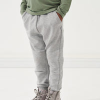 Child posing with their hands in their pockets wearing Heather Gray joggers