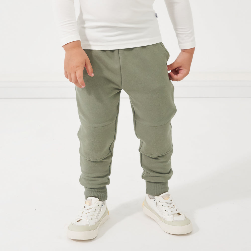 Alternate close up image of a child wearing Moss joggers