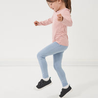Child jumping wearing Fog leggings