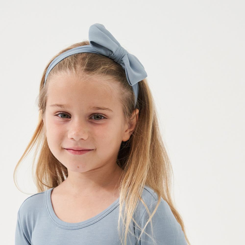 Click to see full screen - Alternate image of a child wearing a Fog luxe bow headband