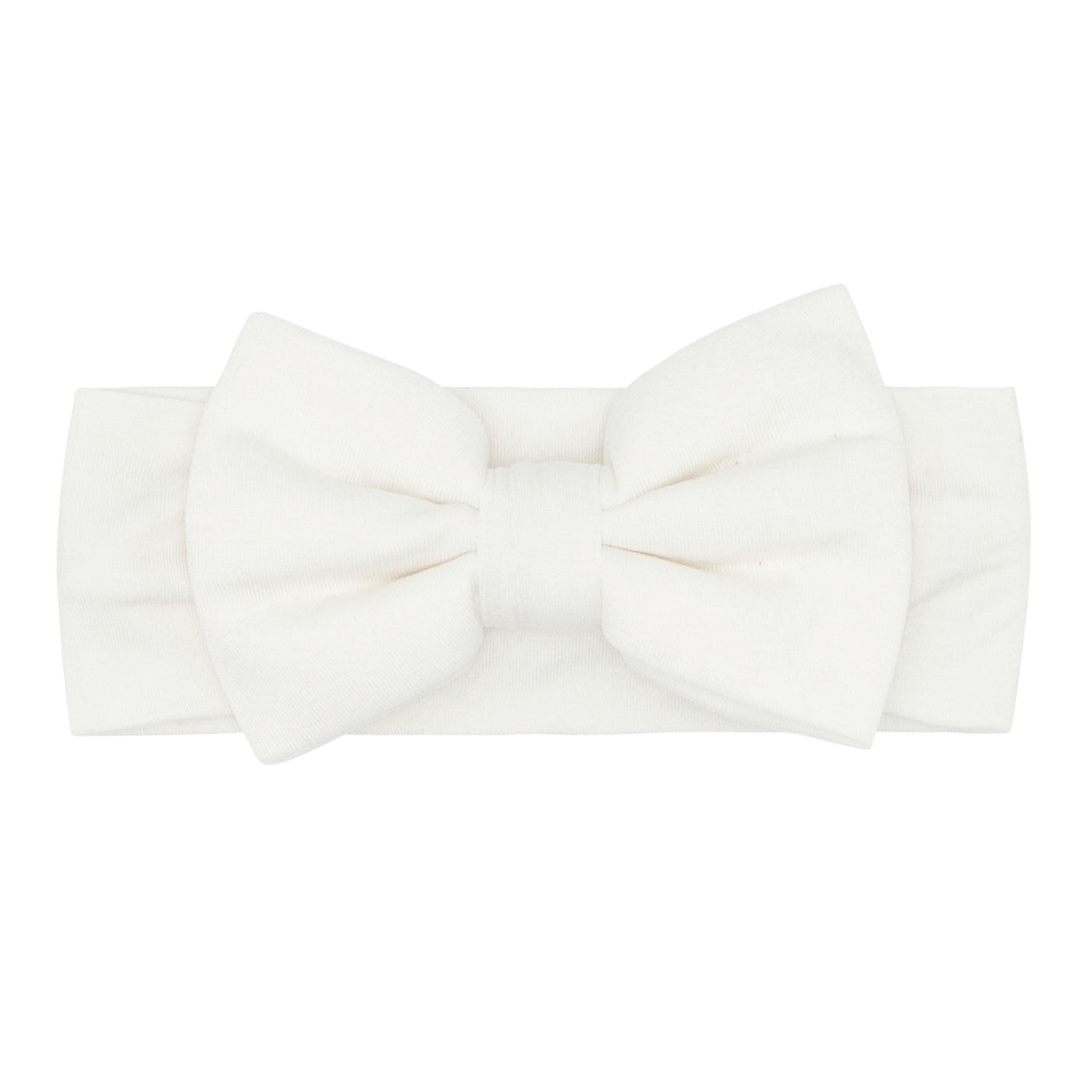 Flat lay image of an Ivory luxe bow headband age newborn to 3T