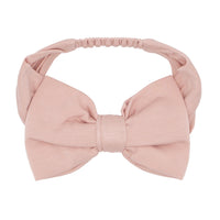 Flat lay image of a Mauve Blush luxe bow headband size age 4 to age 8