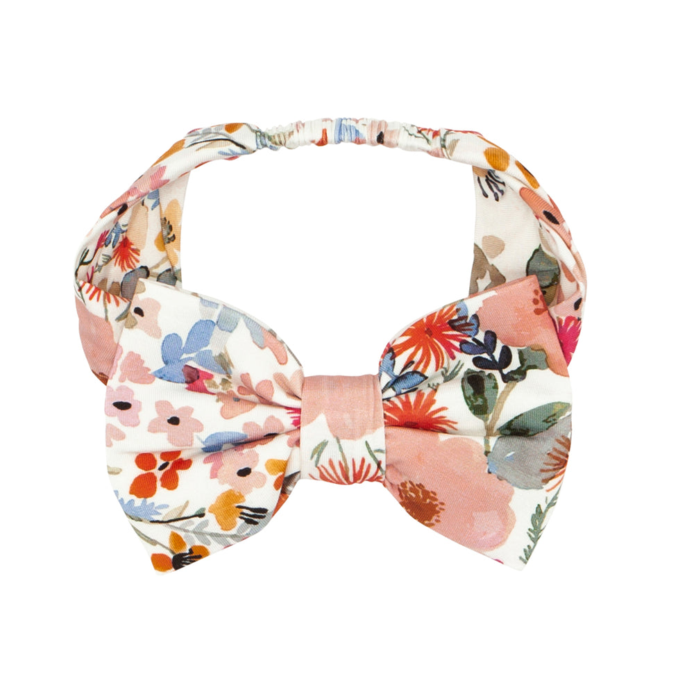 Flat lay image of a Mauve Meadow size age 4 to age 8 luxe bow headband