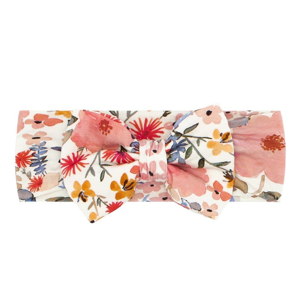 Flat lay image of a Mauve Meadow size Newborn-3T luxe bow headband 