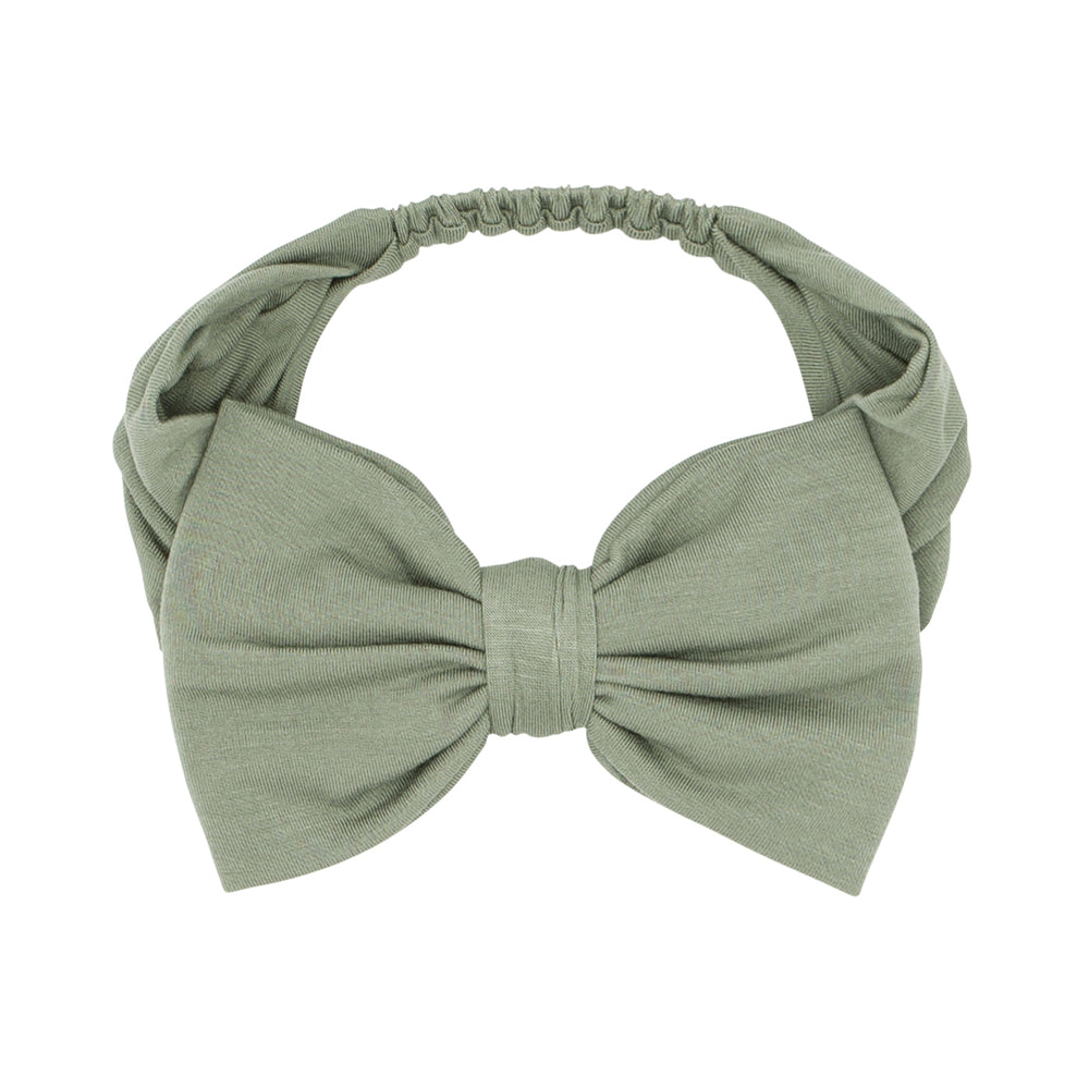 Click to see full screen - Alternate flat lay image of a Moss luxe bow headband