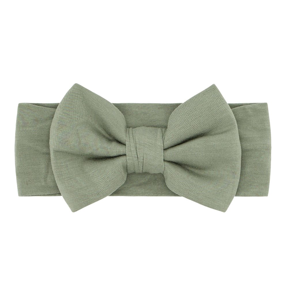 Click to see full screen - Flat lay image of a Moss luxe bow headband